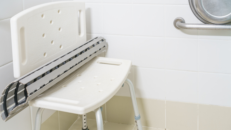 Non slip rubber bath mat on the plastic chair in shower